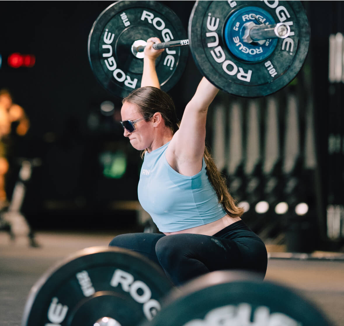 Woman weightlifting wearing Torino sunglasses