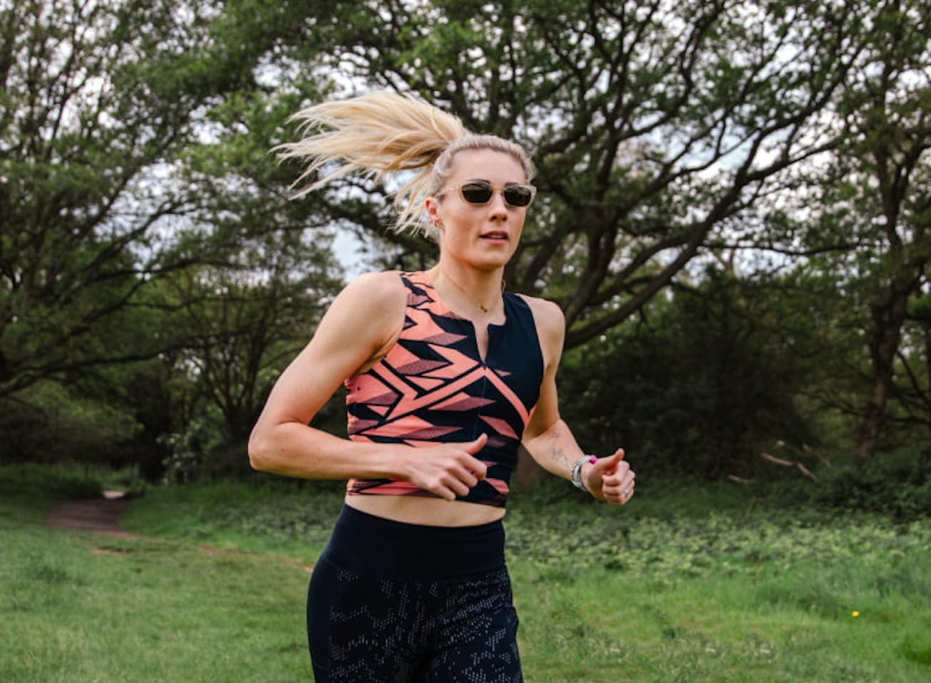 Woman running outside wearing Siena sunglasses