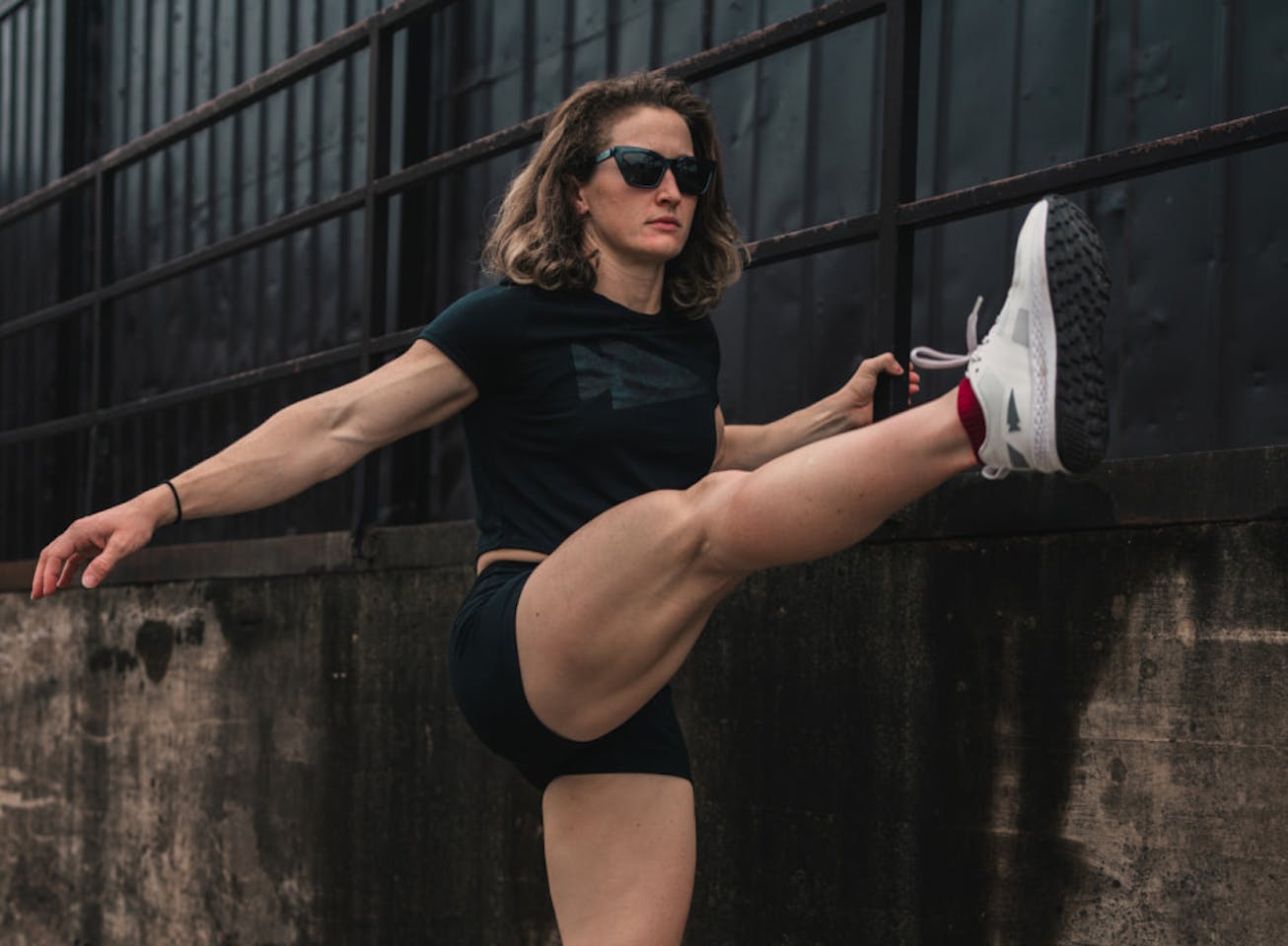 Woman stretching wearing Marfa sunglasses