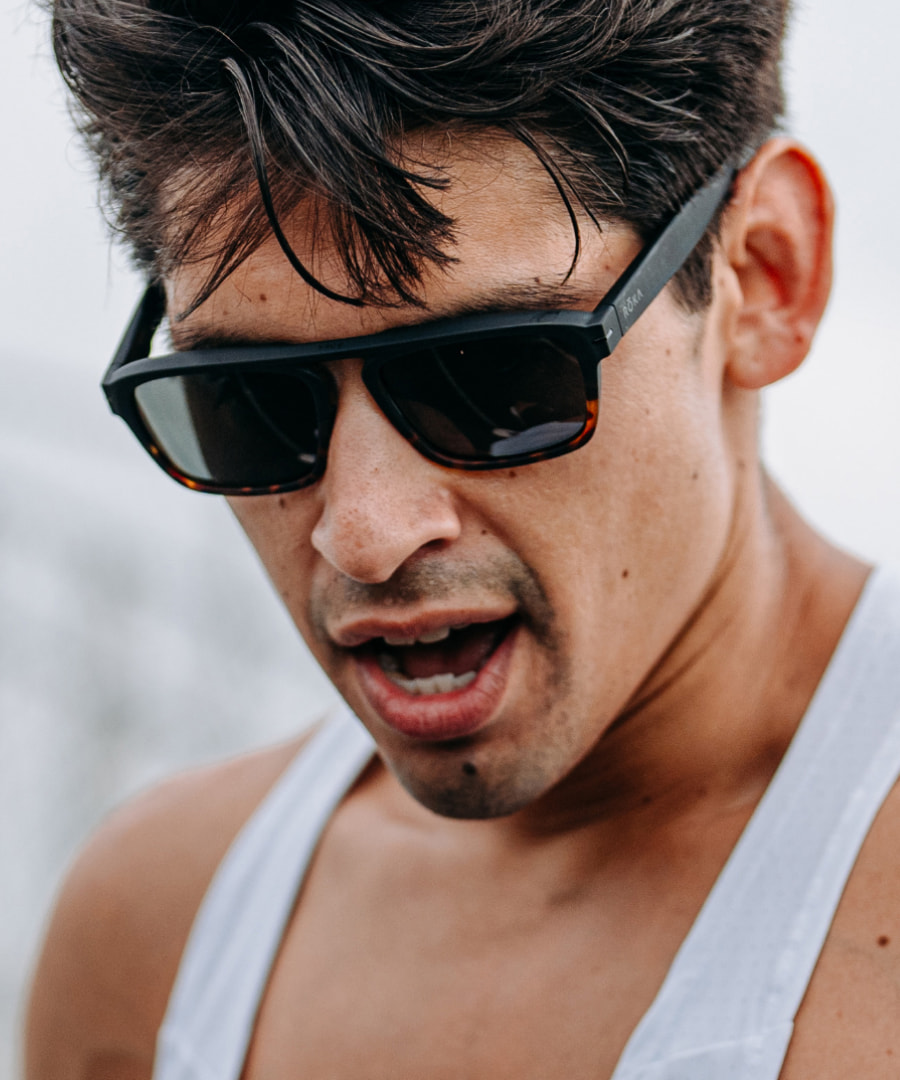 Man looking down wearing Estacado sunglasses