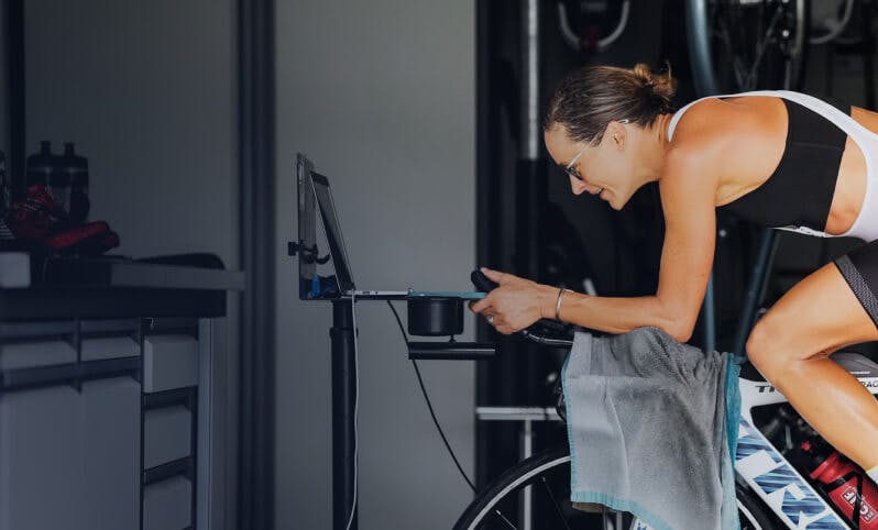 Woman riding stationary bike