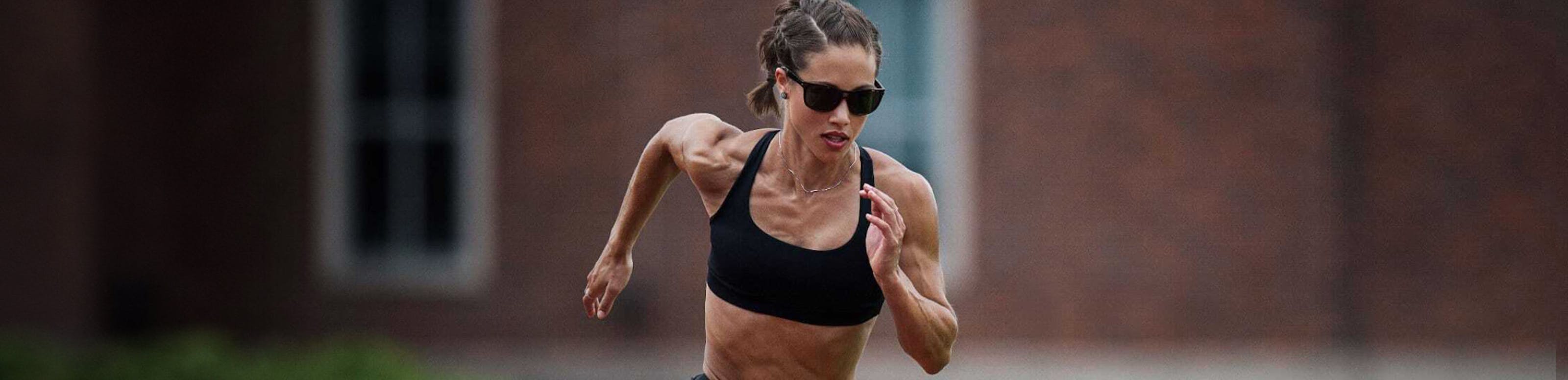 Woman running wearing ROKA sunglasses