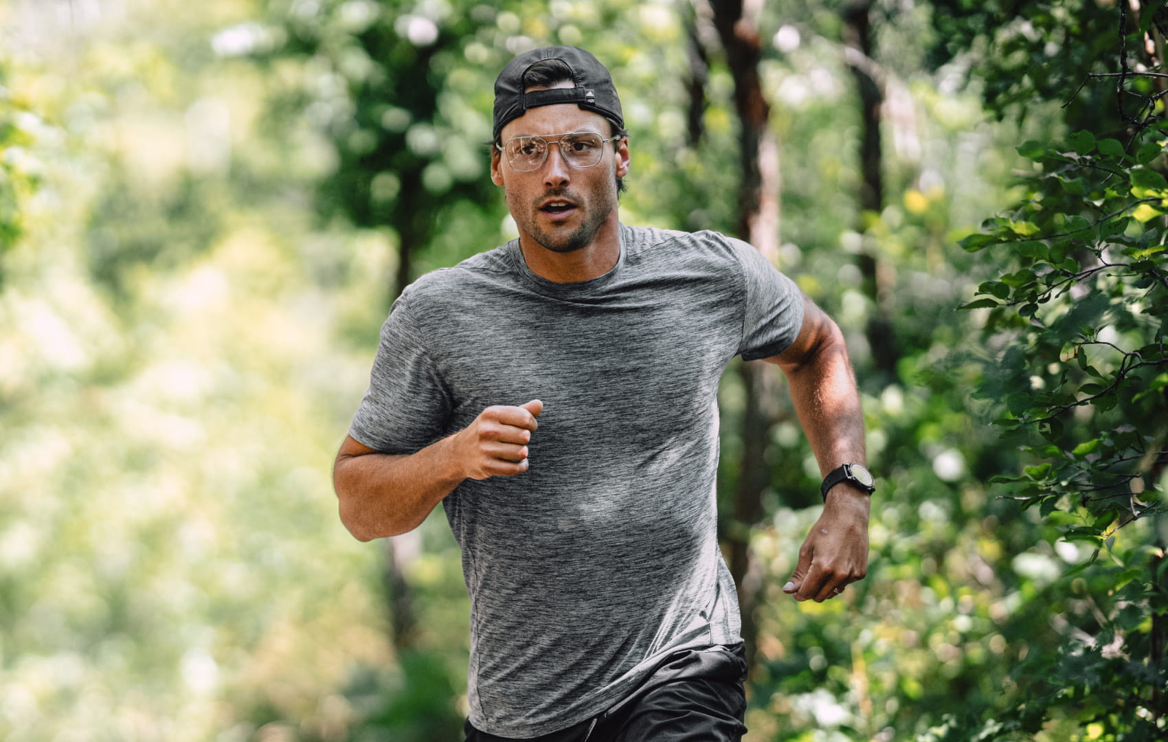 Man running outside wearing Falcon Titanium eyeglasses