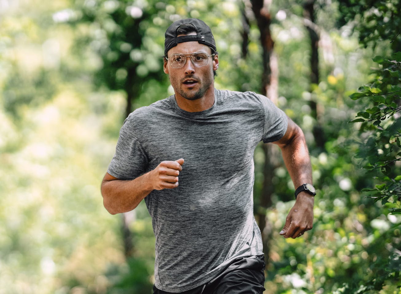 Man running outside wearing Falcon Titanium eyeglasses