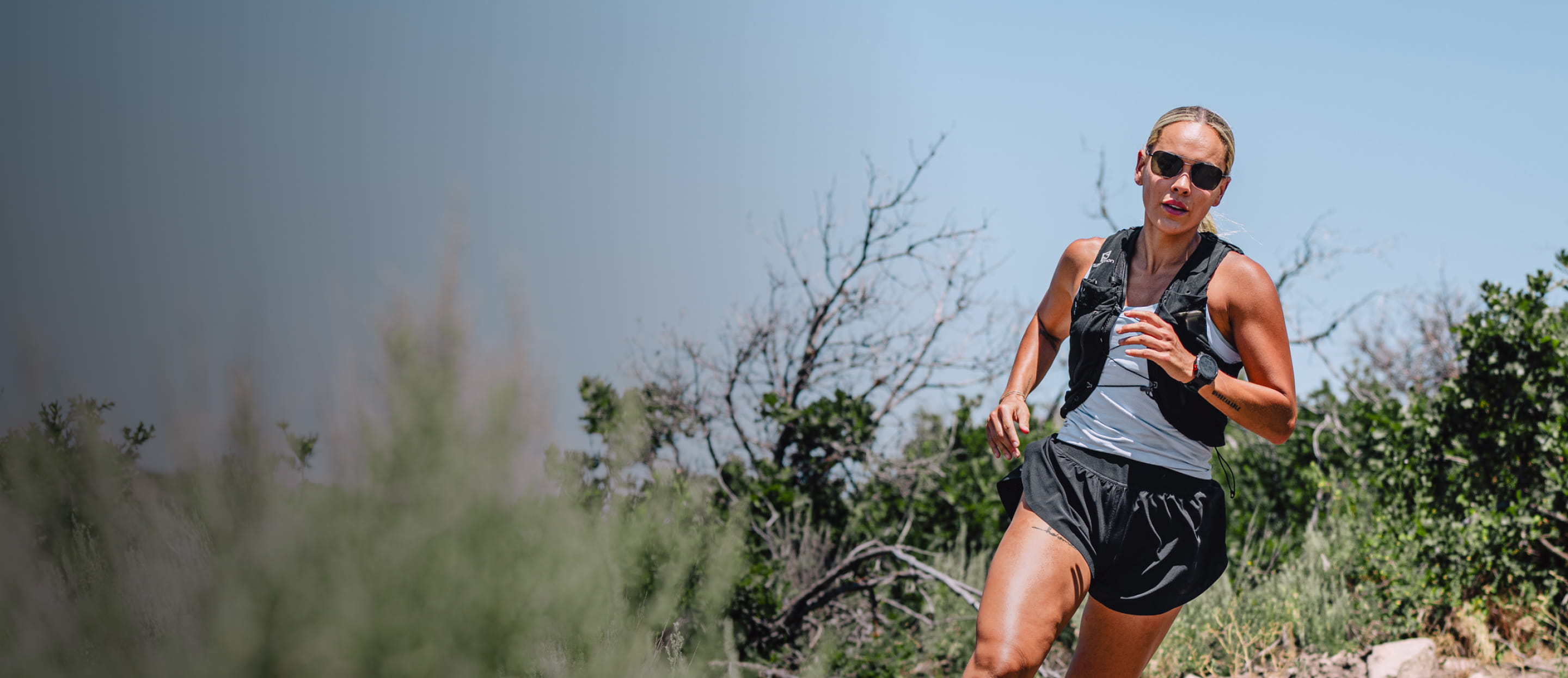 Woman running outside wearing Falcon sunglasses