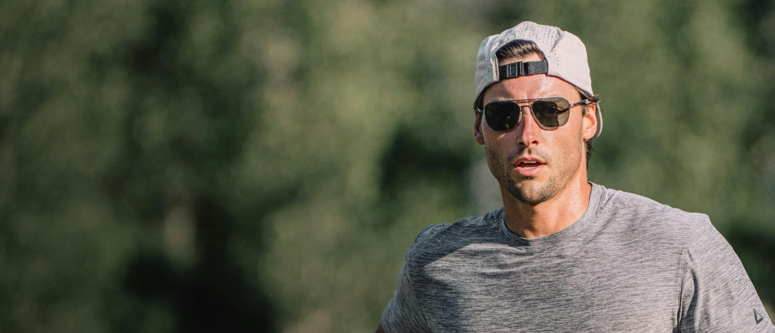 Man outside wearing Falcon sunglasses