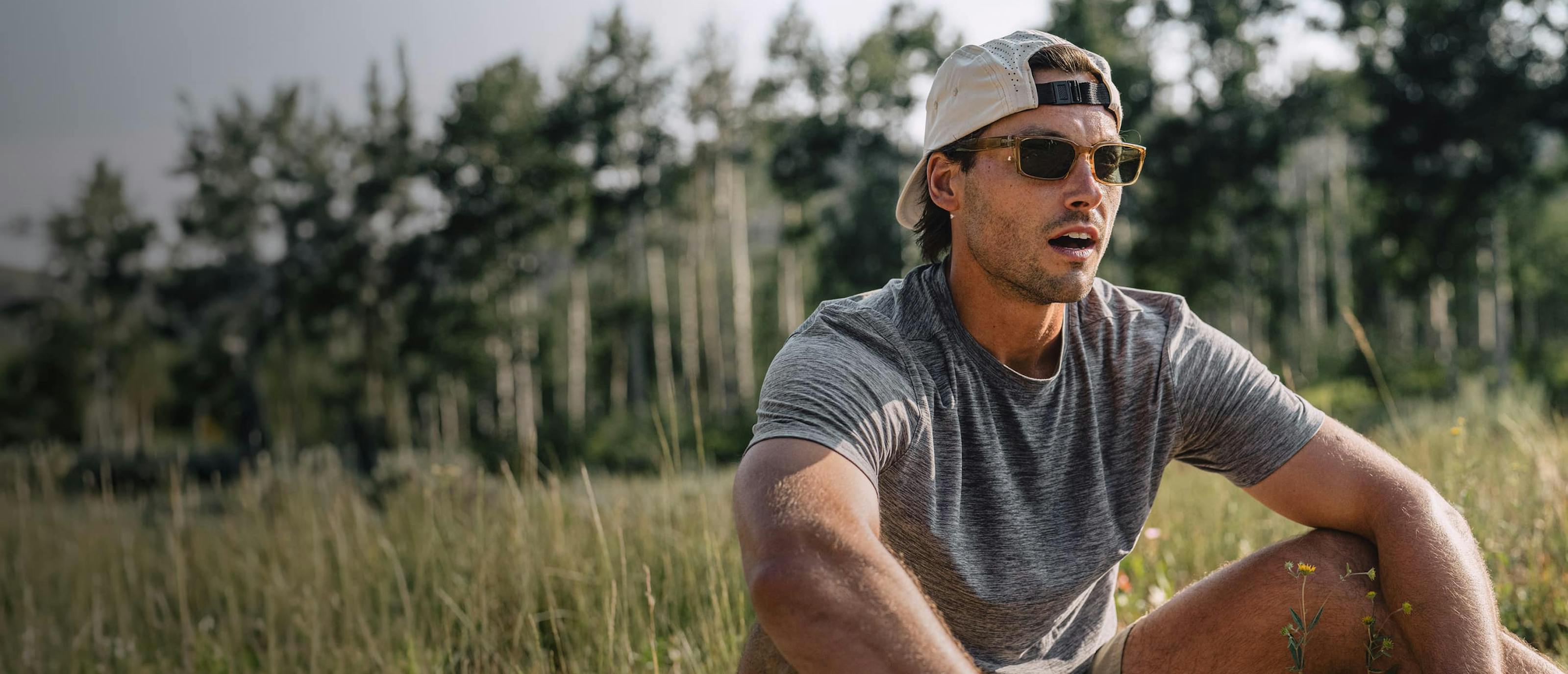 Man resting outside wearing Mayfield sunglasses