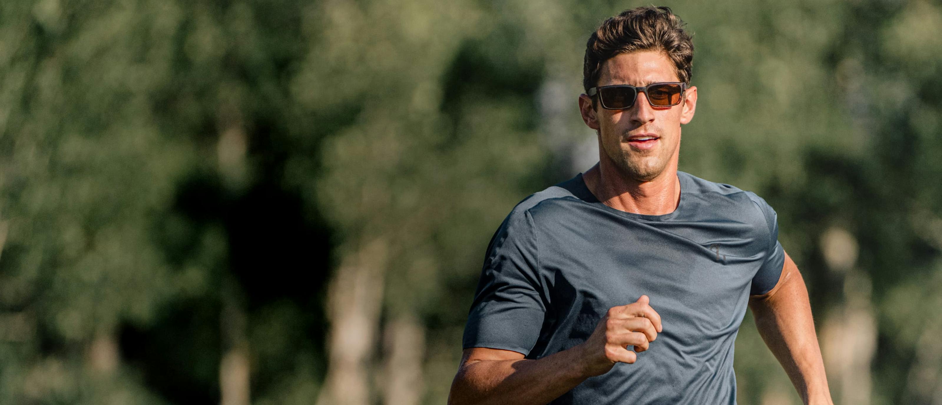 Man running outside wearing Mayfield sunglasses
