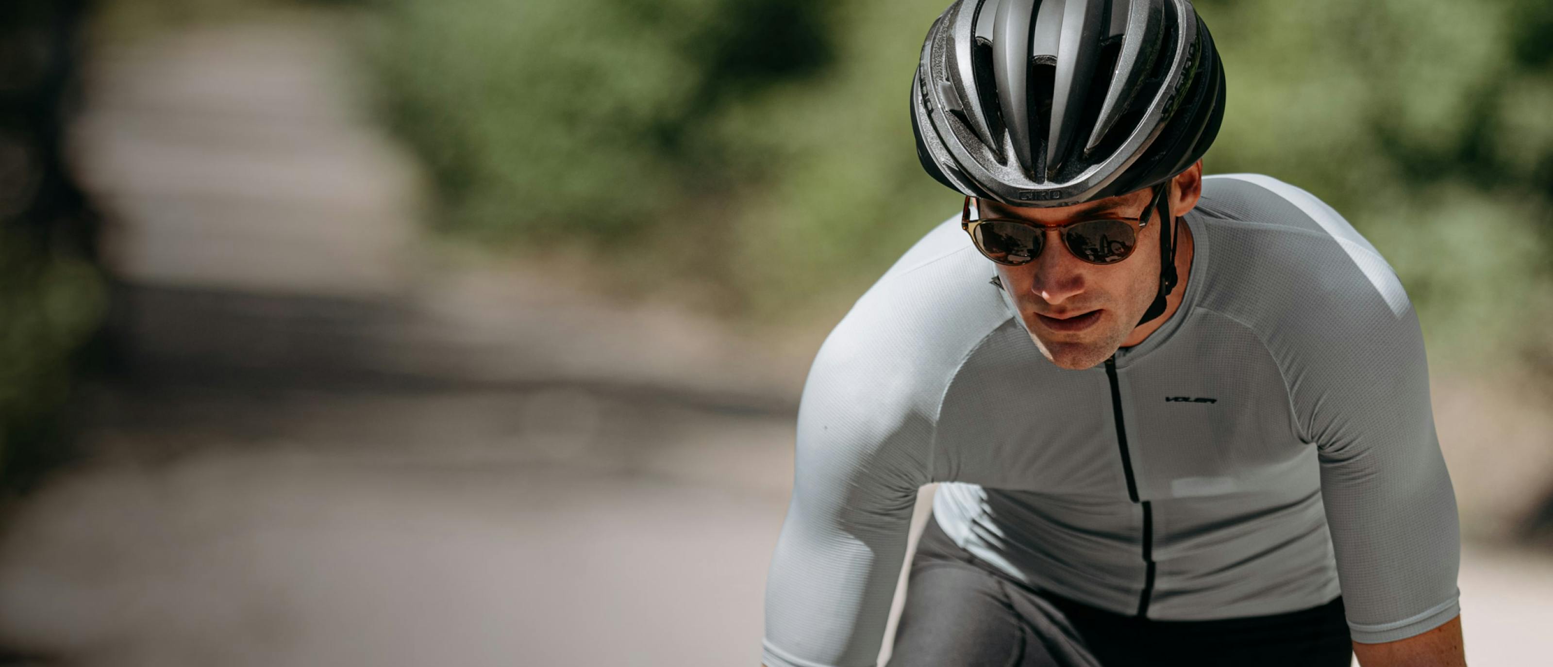 Man cycling wearing Oslo sunglasses
