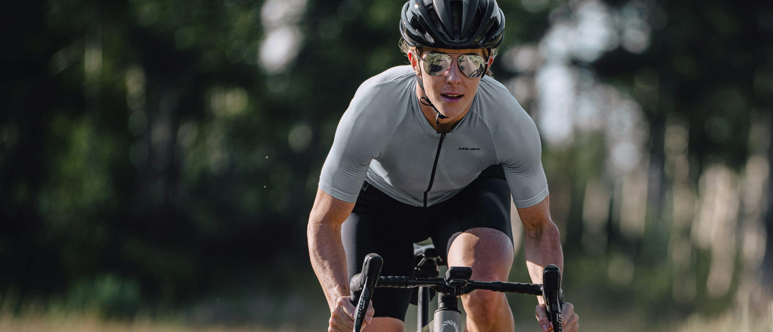 Woman cycling wearing Phantom sunglasses