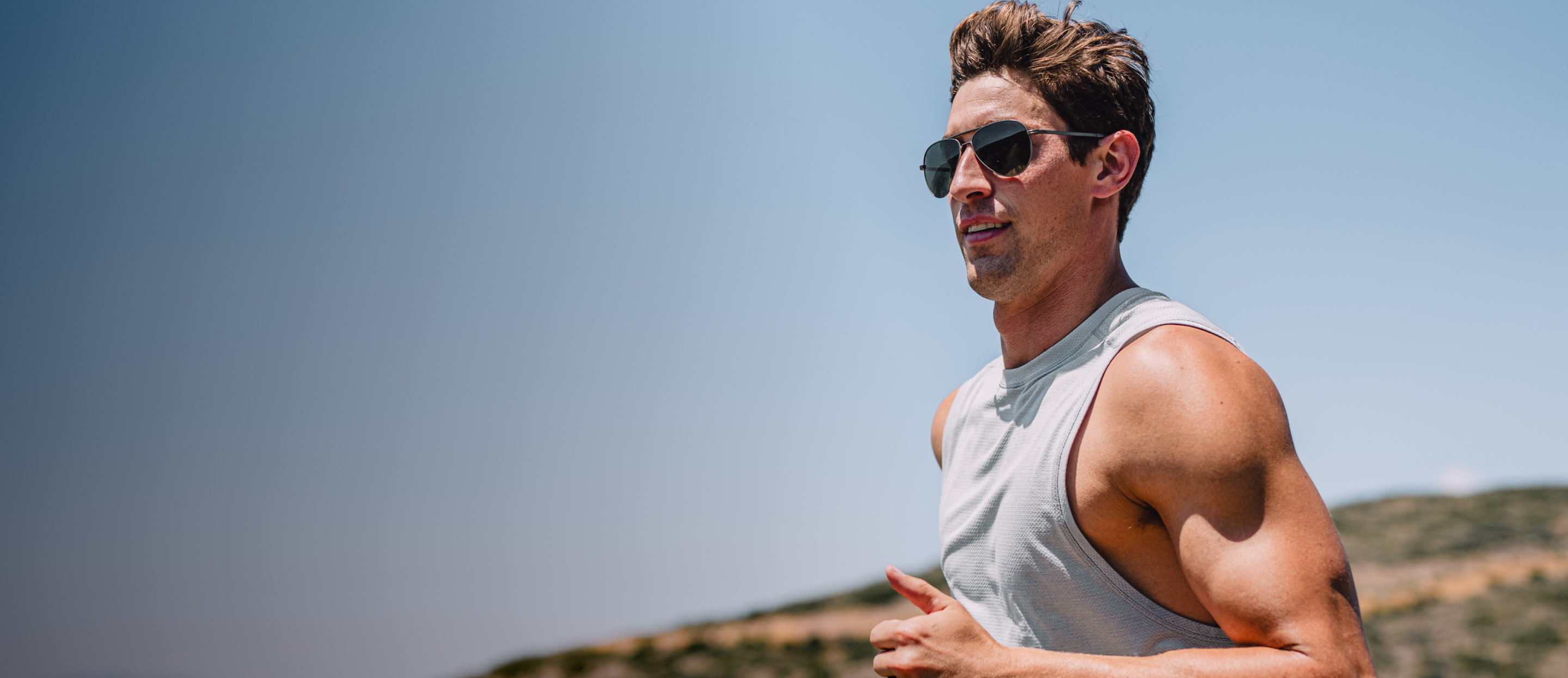 Man running outside wearing Phantom sunglasses