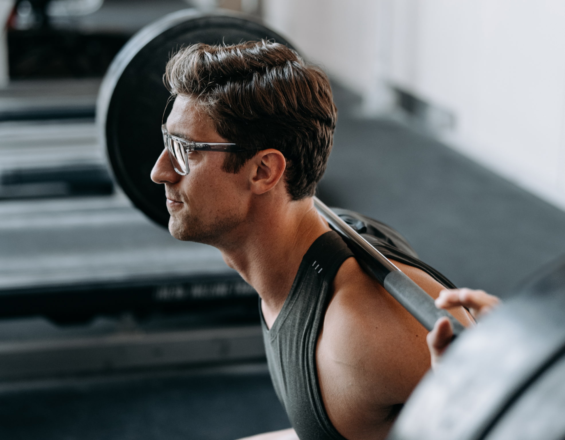 Man weightlifting wearing Barton eyeglasses