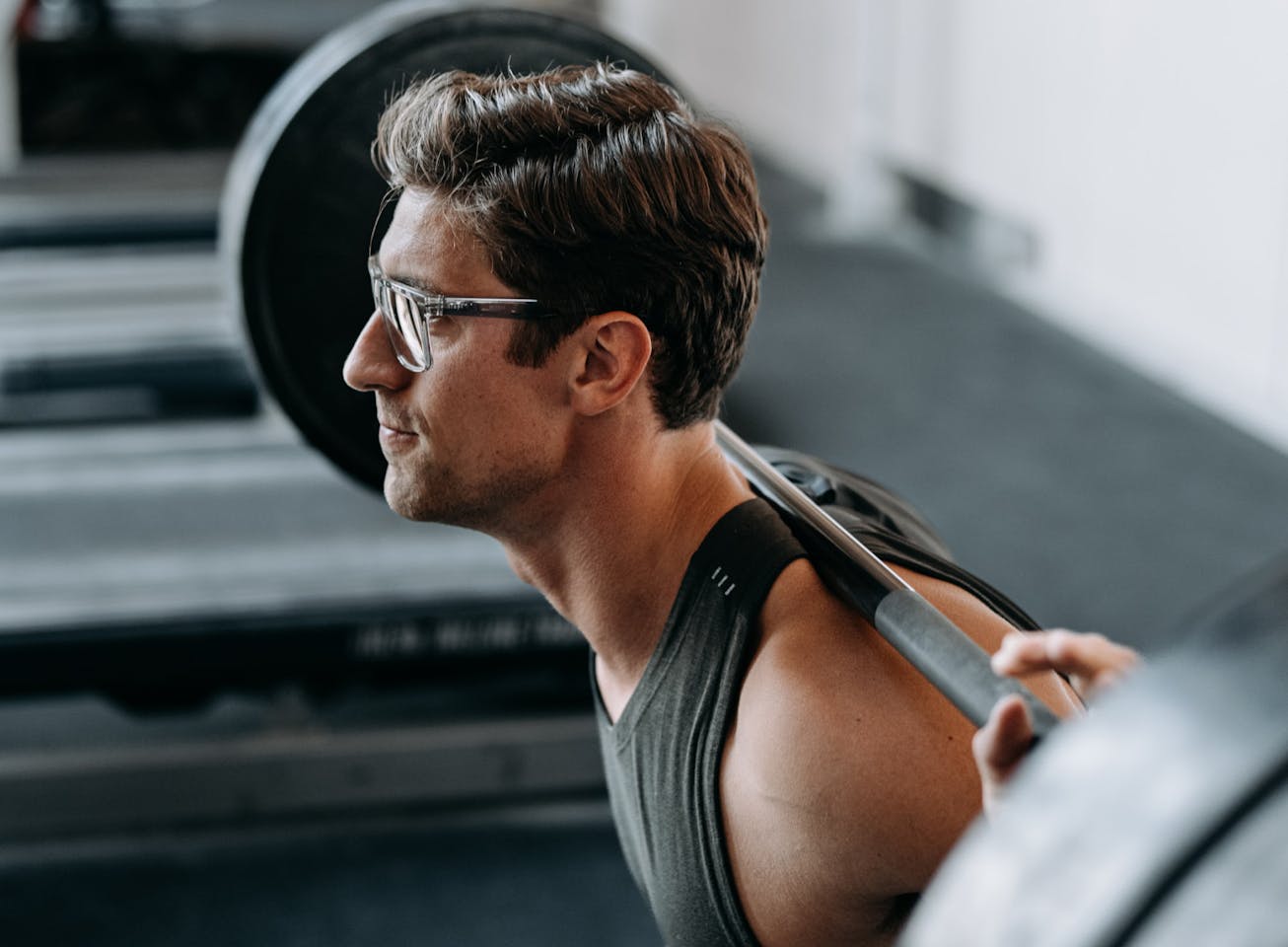 Man weightlifting wearing Barton eyeglasses