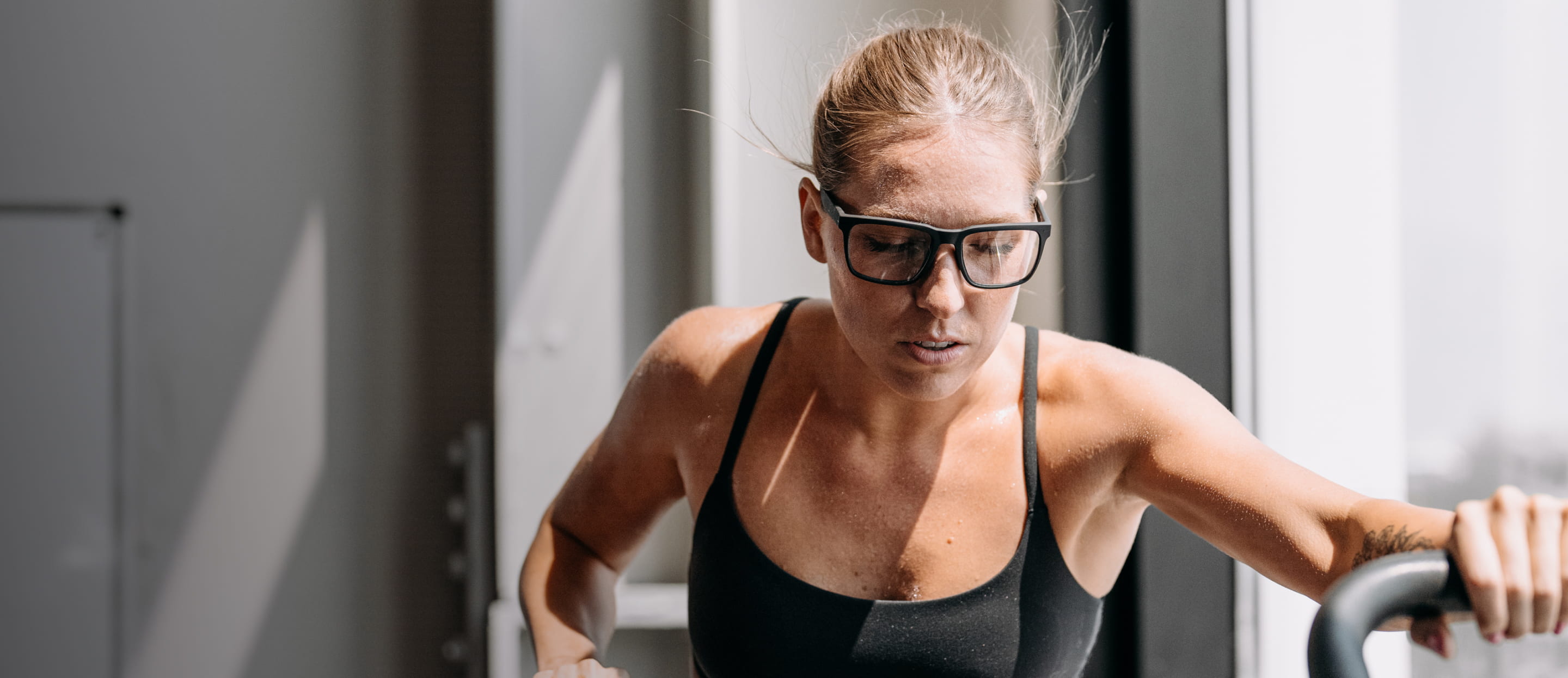 Woman exercising wearing Barton eyeglasses