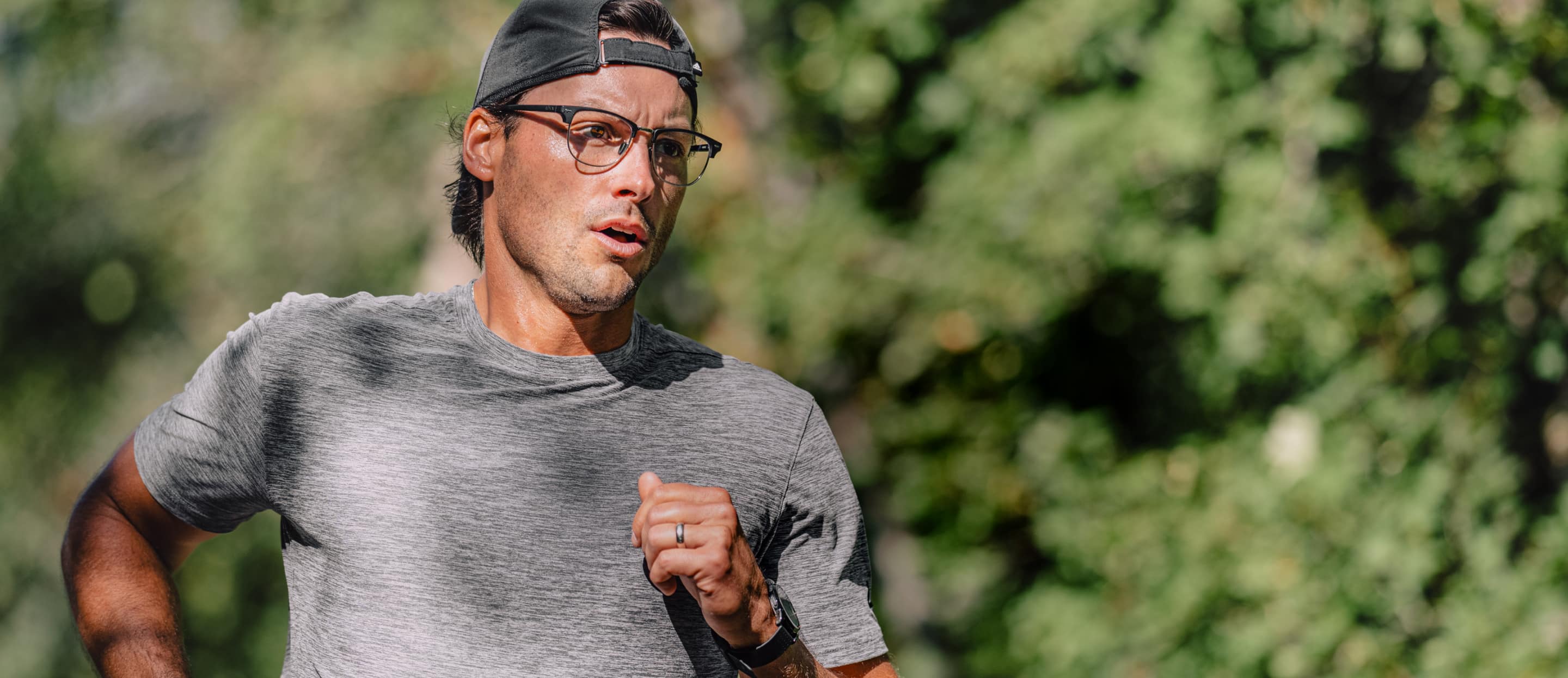 Man running outside wearing Cambridge eyeglasses