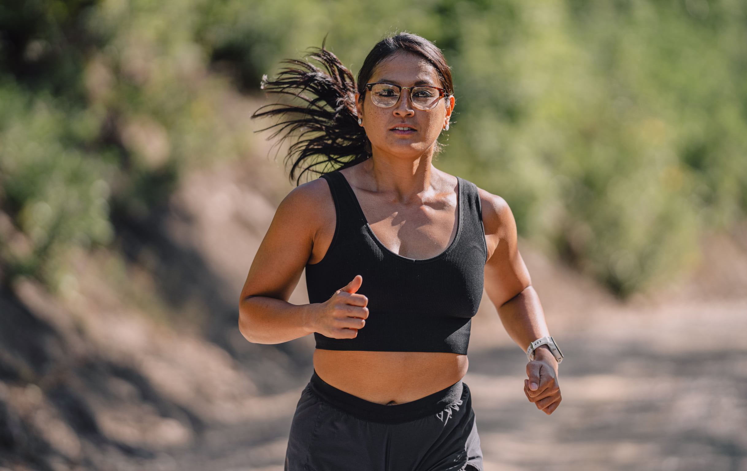 Woman running outside wearing Cambridge eyeglasses