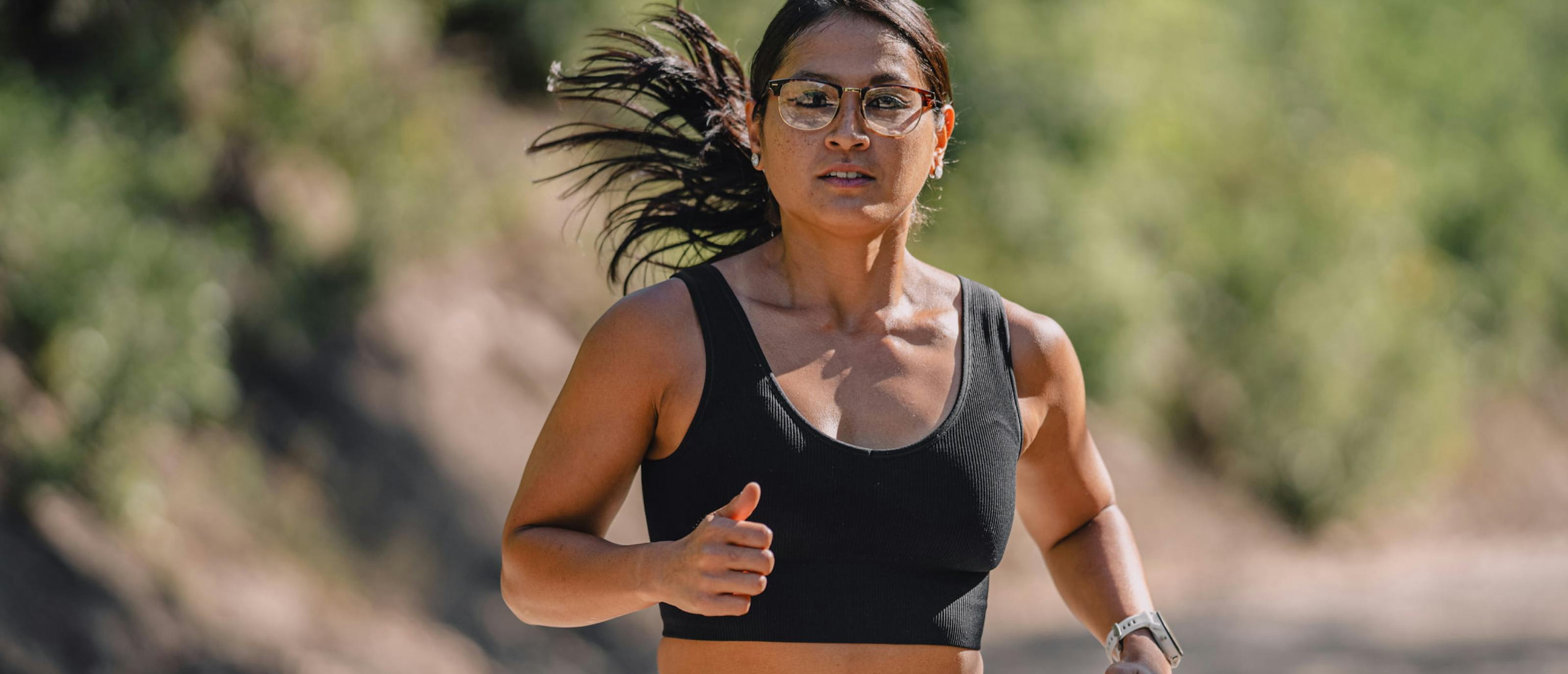 Woman running outside wearing Cambridge eyeglasses