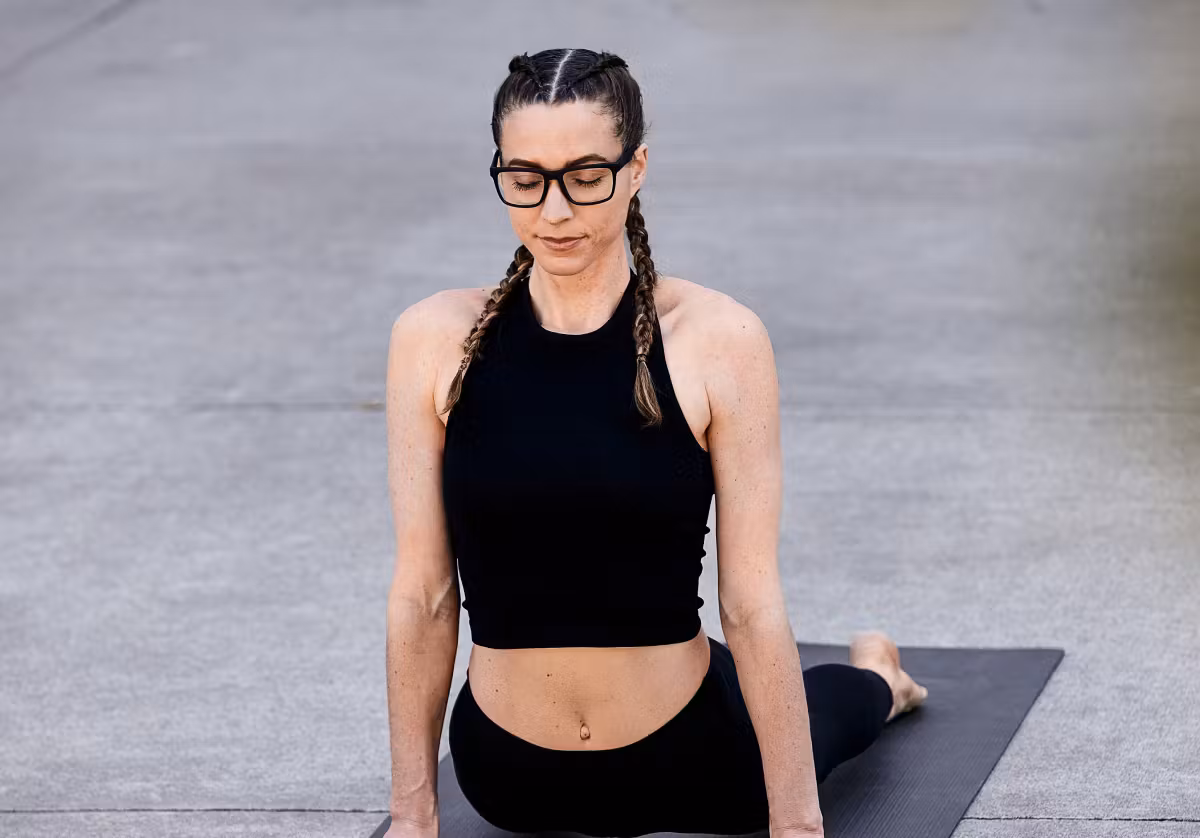 Woman doing yoga wearing Barton eyeglasses