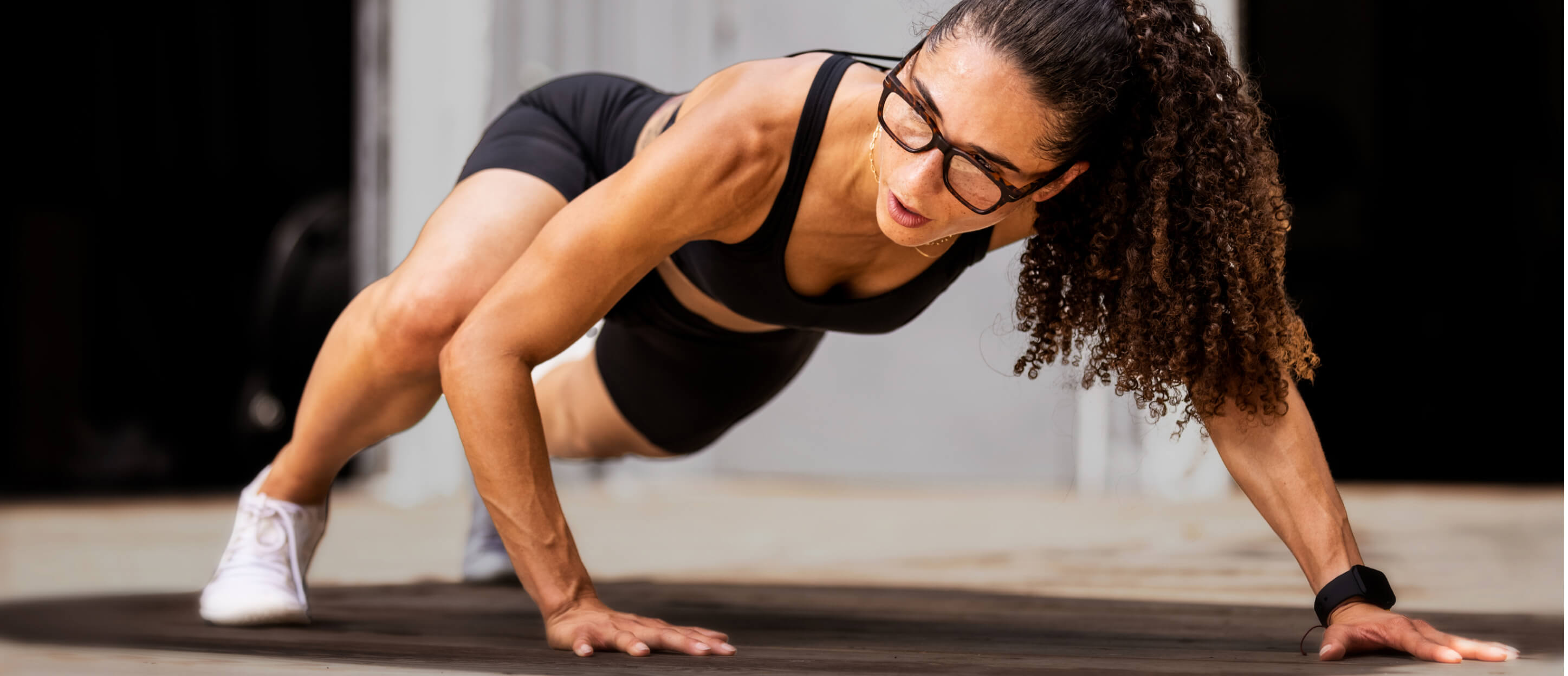 Woman planking in Lockhart eyeglasses