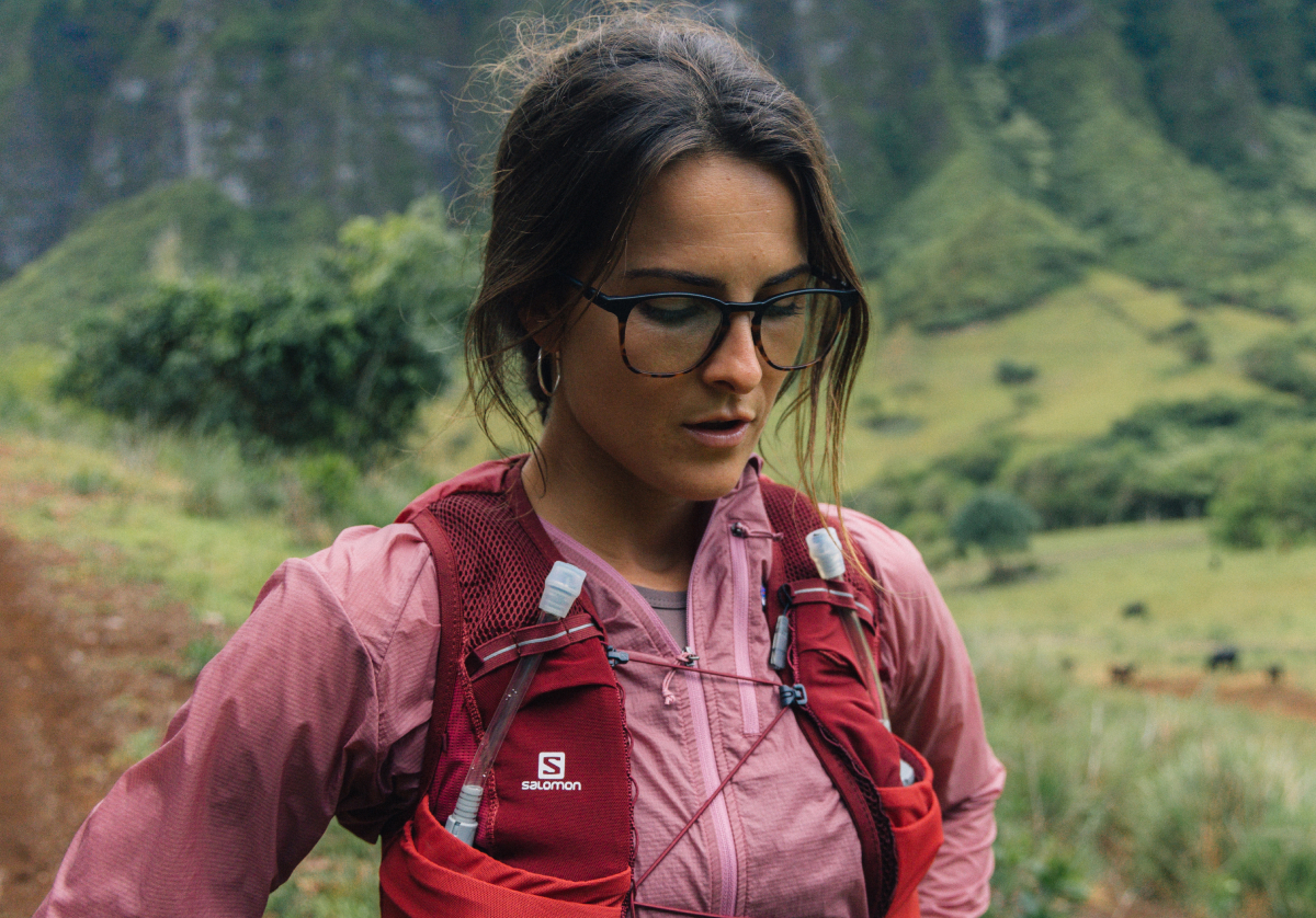 Woman standing wearing square, campfire tortoise Hunter eyeglasses