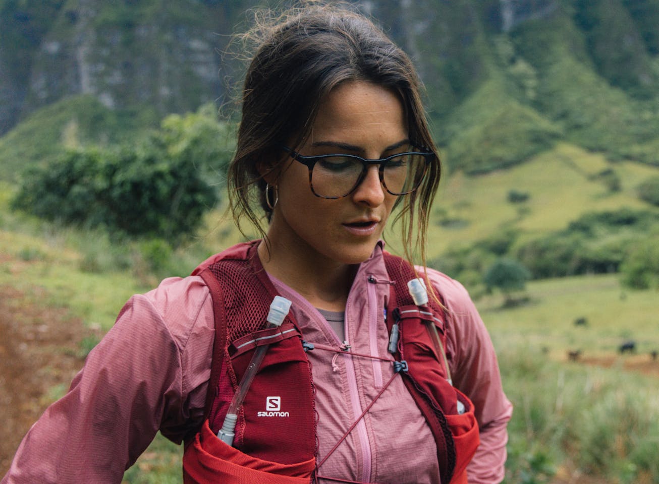 Woman standing wearing square, campfire tortoise Hunter eyeglasses