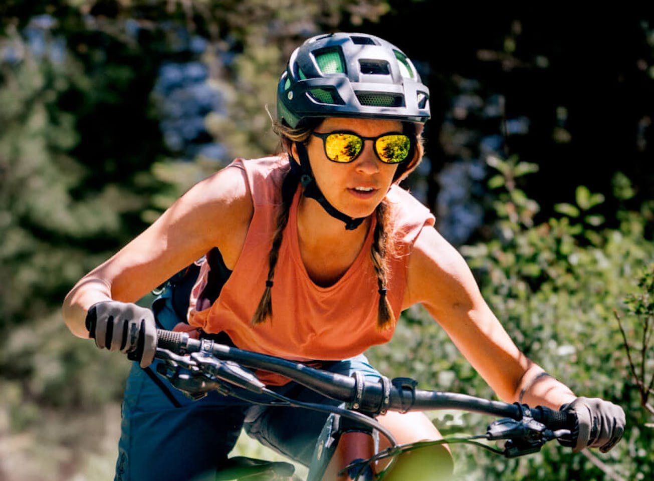 Woman riding mountain bike in Rory Sunglasses