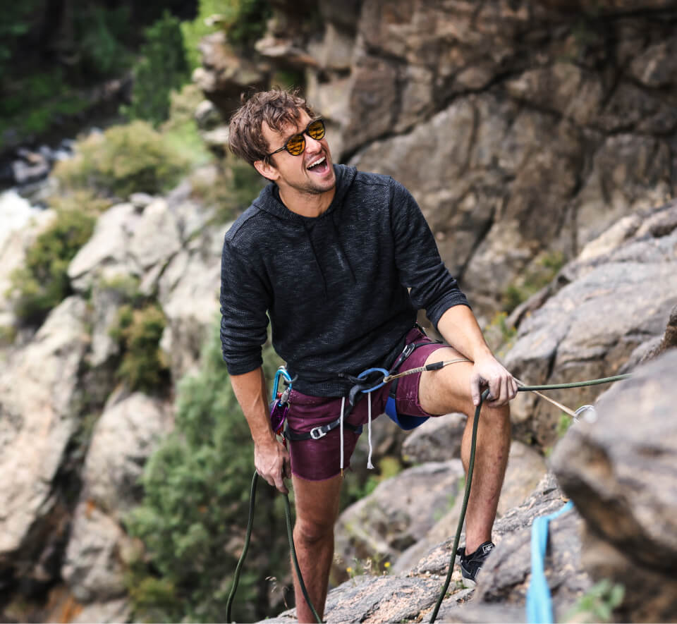 Man in rock climbing gear and Oslo Sunglasses