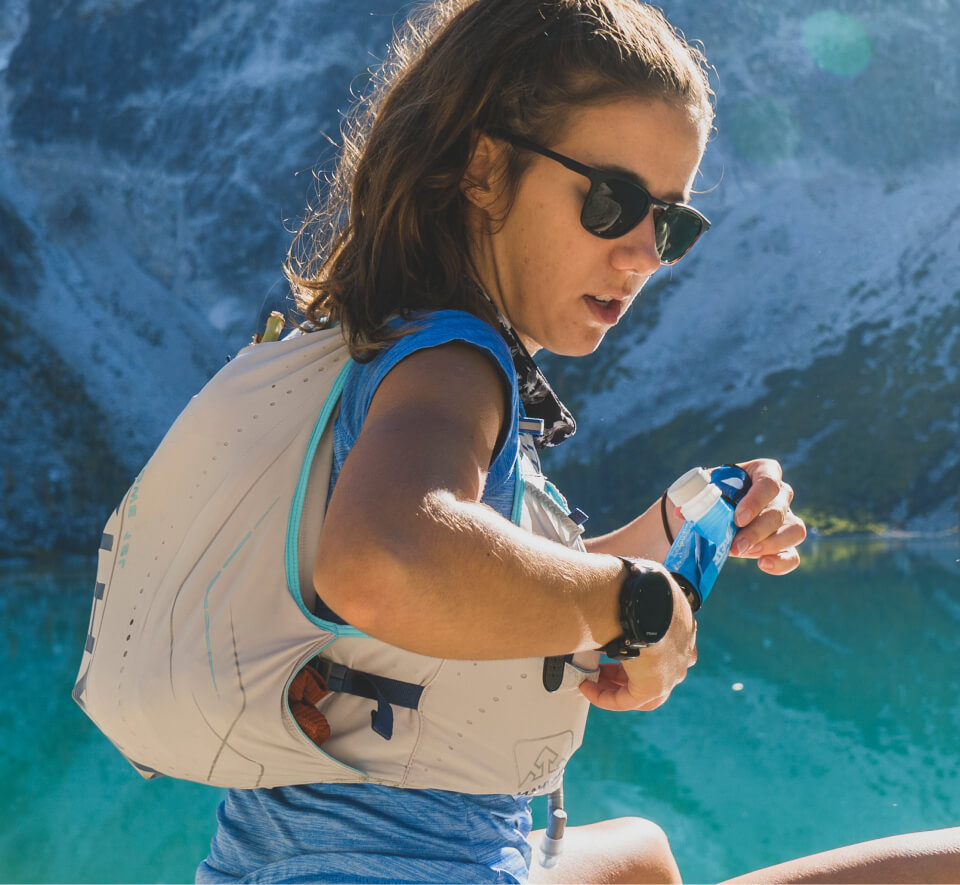 Woman standing in front of glacier