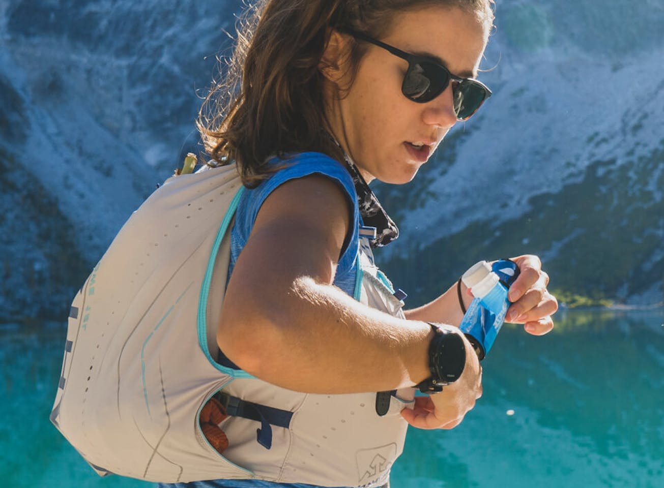Woman standing in front of glacier