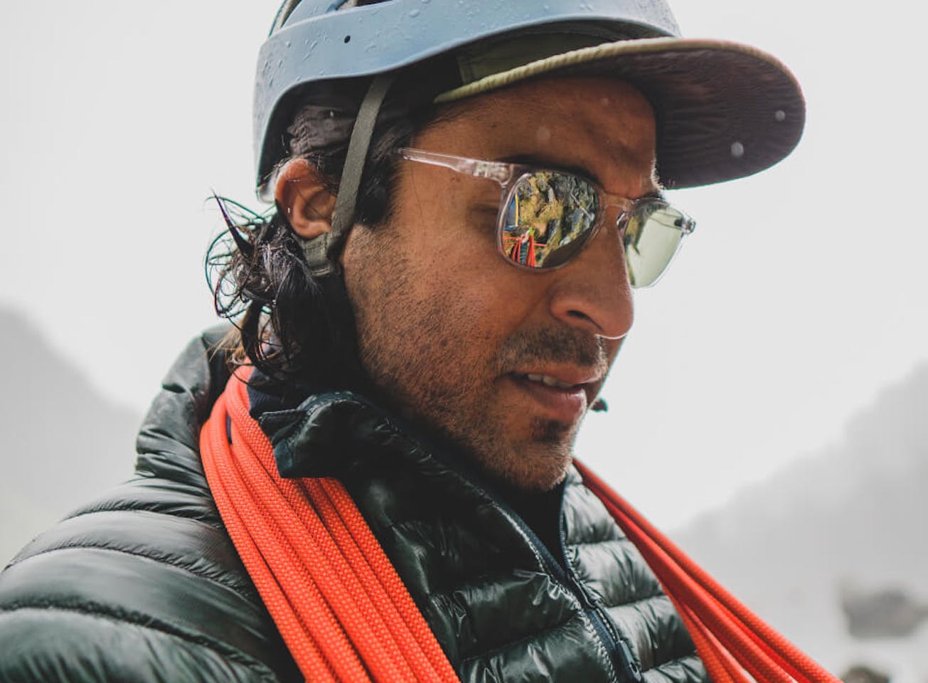 Man with climbing rope and Hunter sunglasses