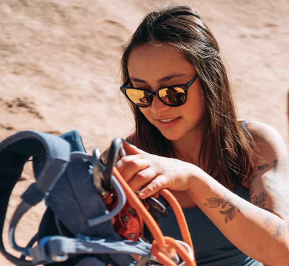 Woman with climbing rope and Lola sunglasses