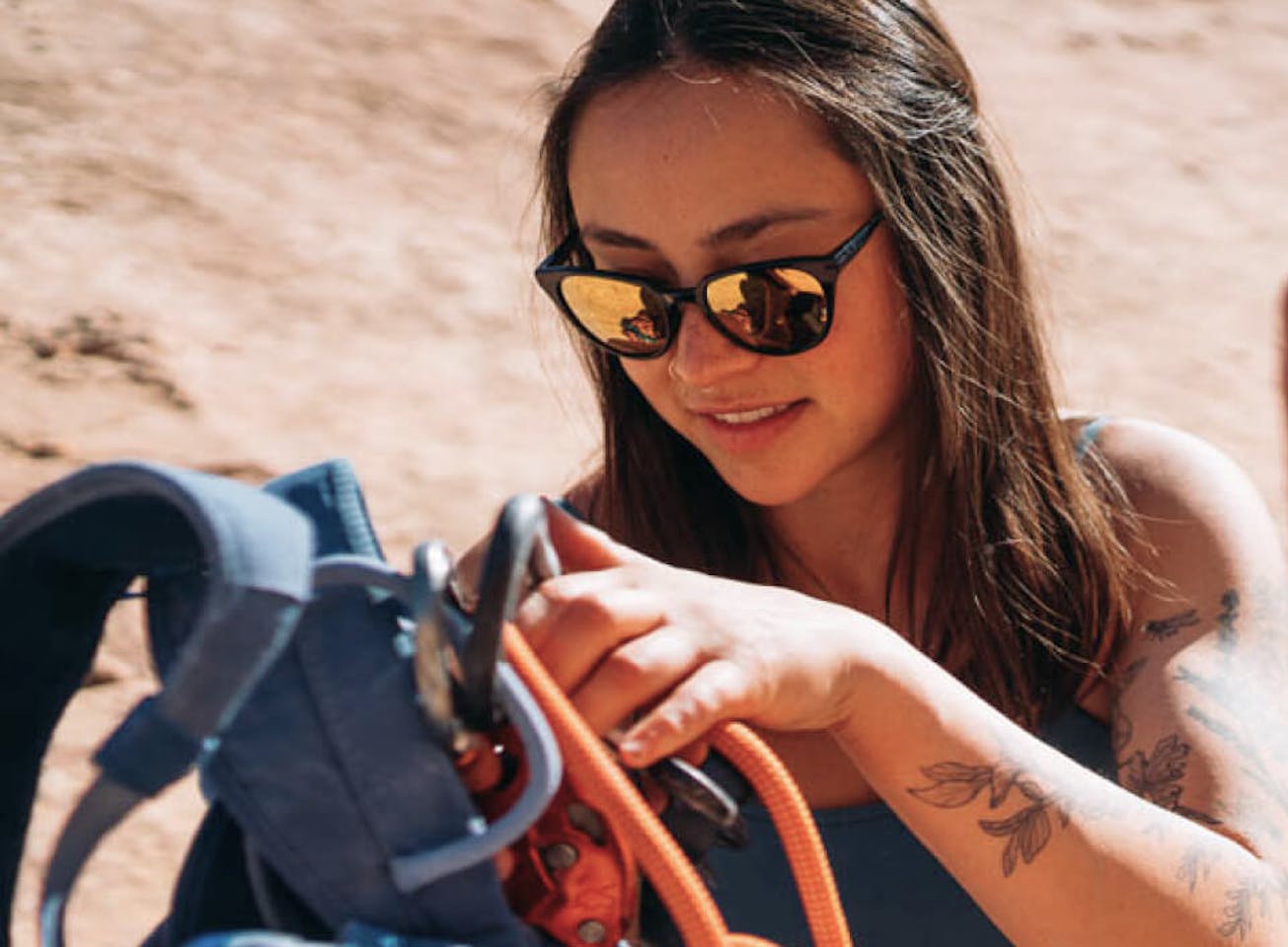 Woman with climbing rope and Lola sunglasses