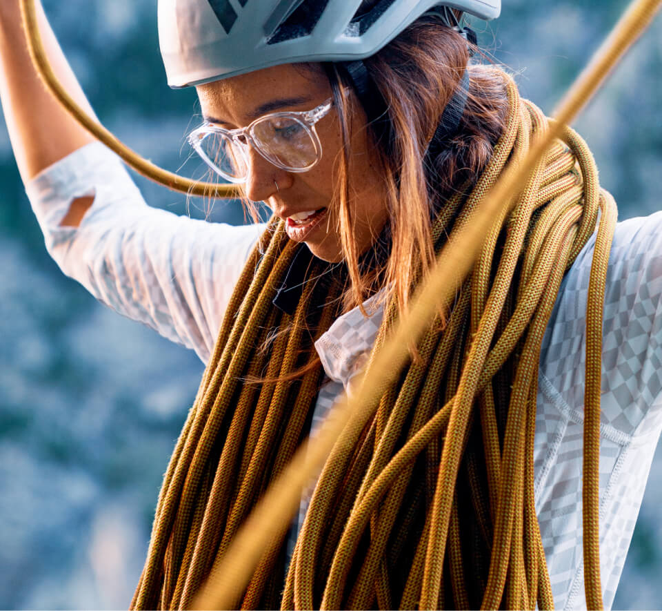 Woman organizing climbing rope in Oslo Eyeglasses