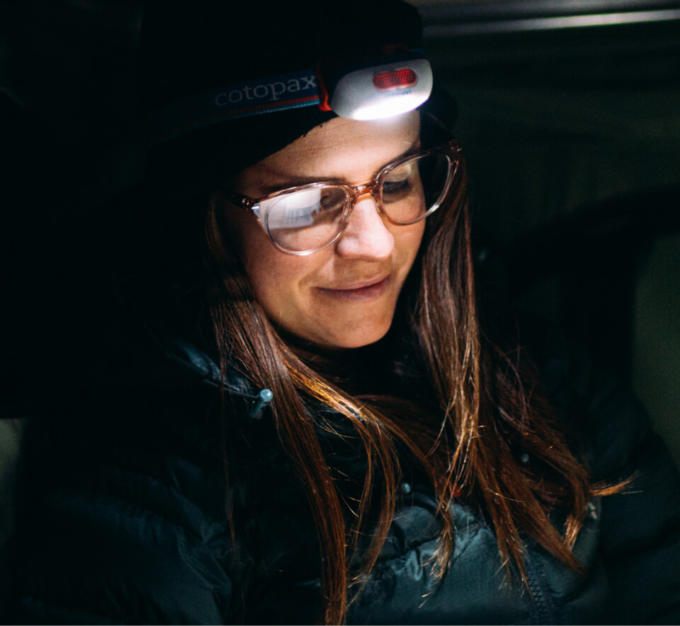 Woman using headlamp and Lola eyeglasses