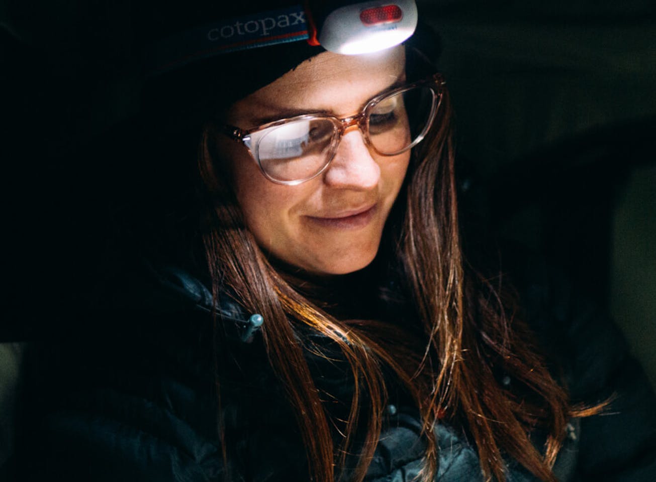 Woman using headlamp and Lola eyeglasses