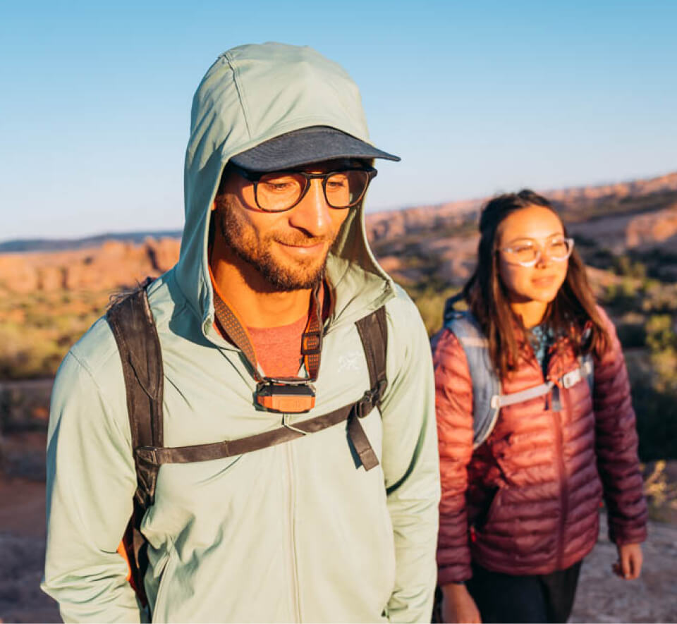 Man and woman backpacking in desert