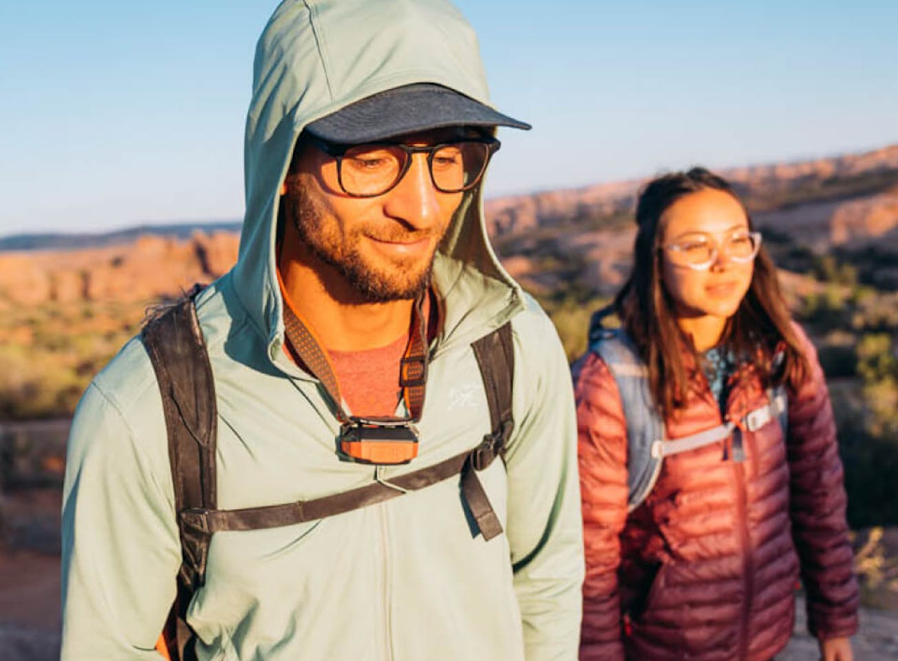 Man and woman backpacking in desert