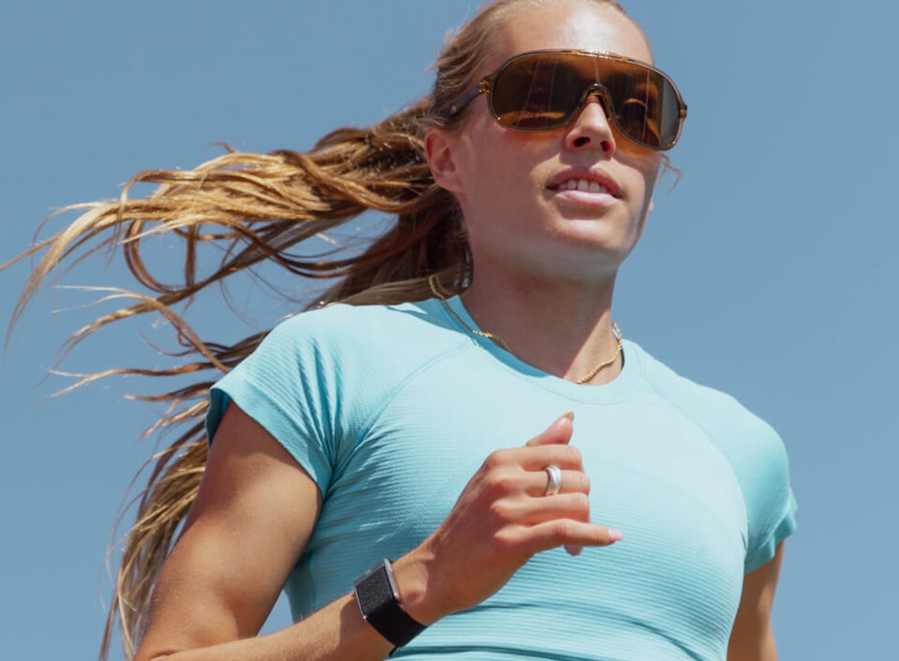 Woman jogging in blue top