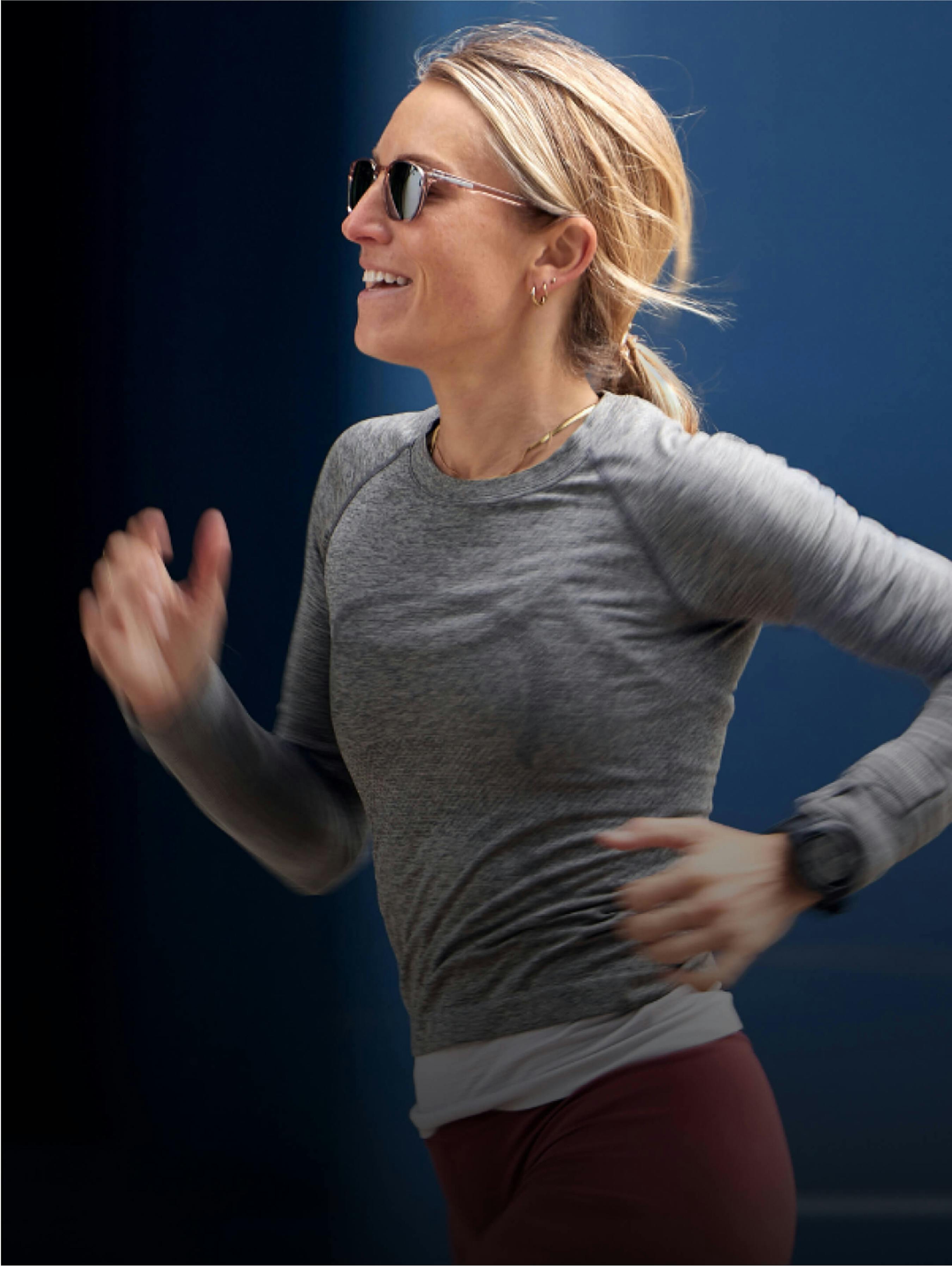 Woman running in gray top
