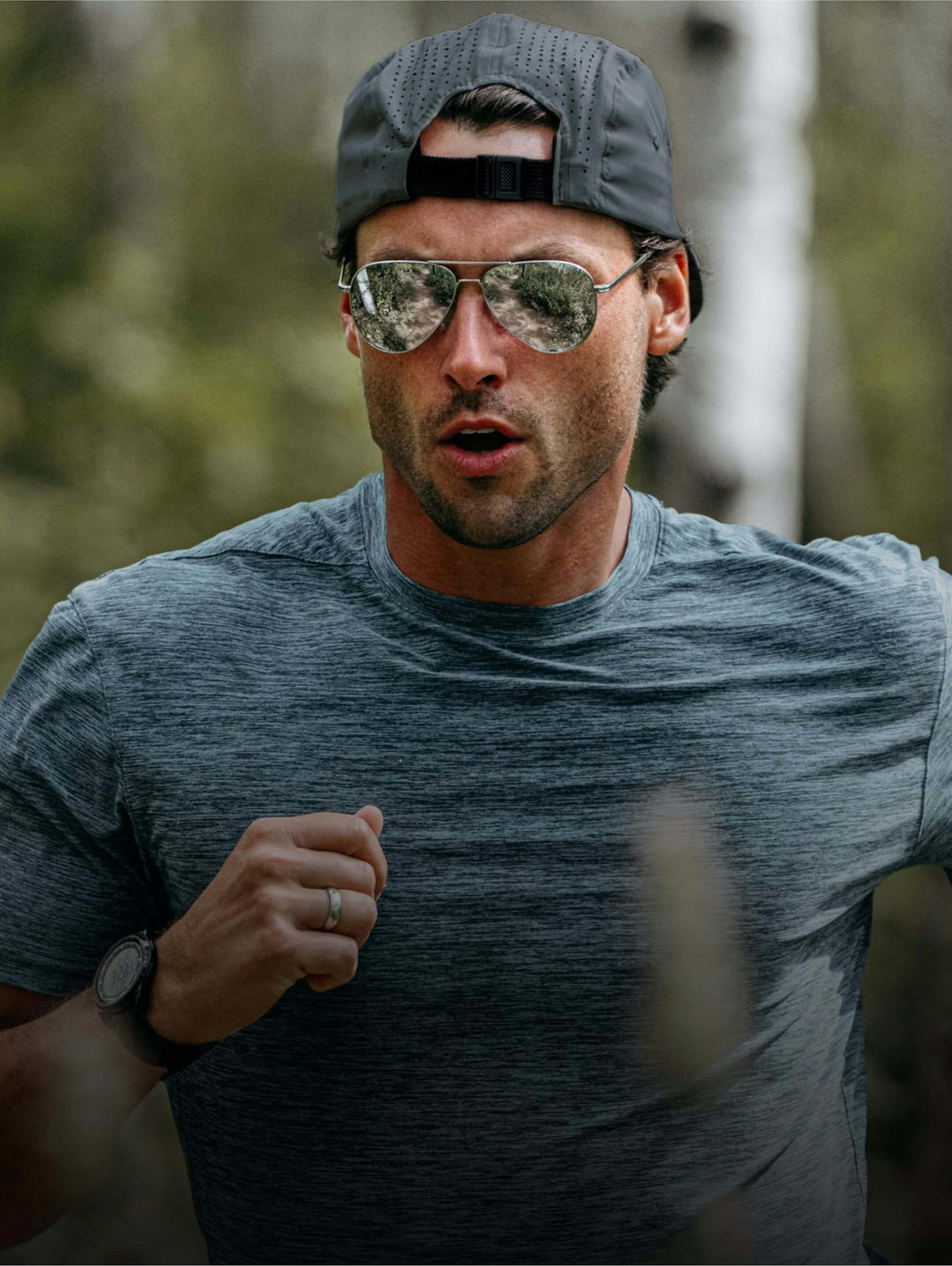 Man running in backwards hat