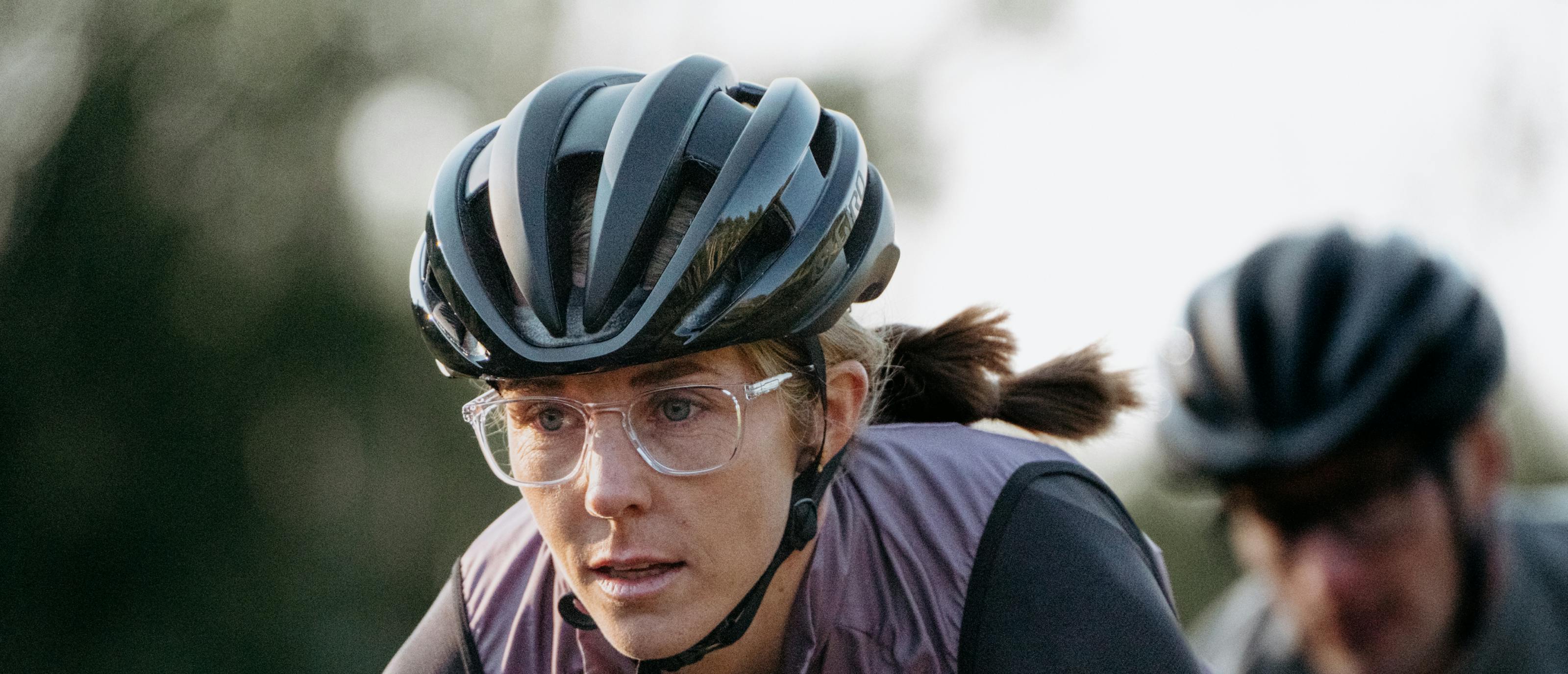 Woman riding bike in Rory eyeglasses