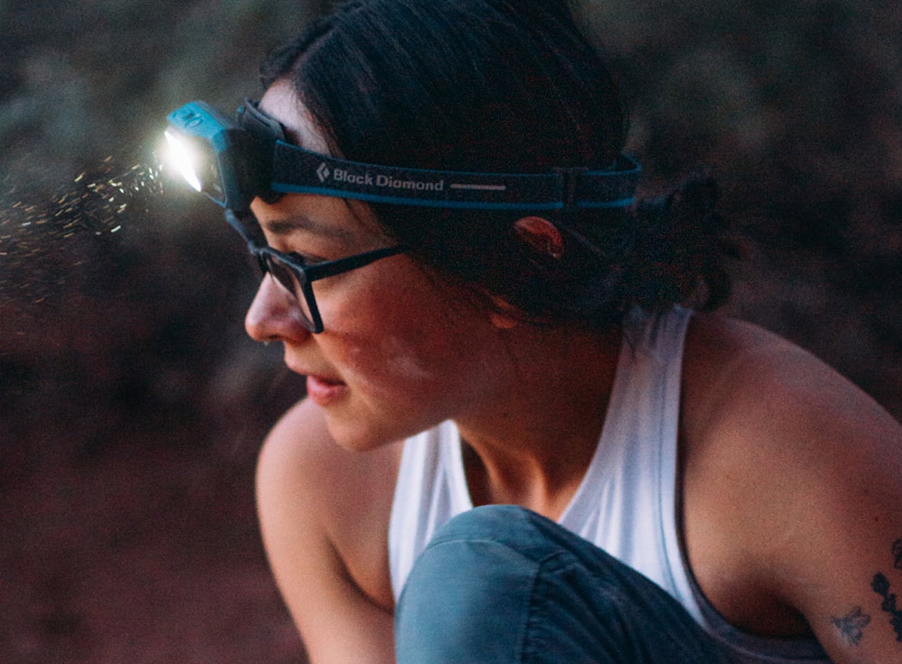 woman in Rory eyeglasses and headlamp