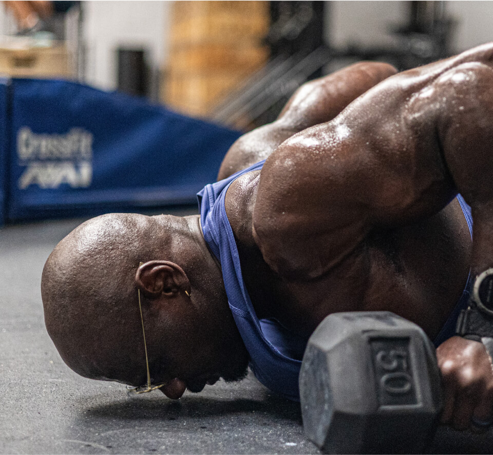Man doing dumbell push up in Vapor eyeglasses