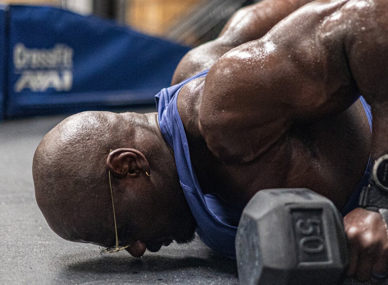 Man doing dumbell push up in Vapor eyeglasses