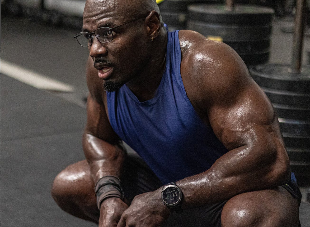 Man in purple tank top and Vapor eyeglasses