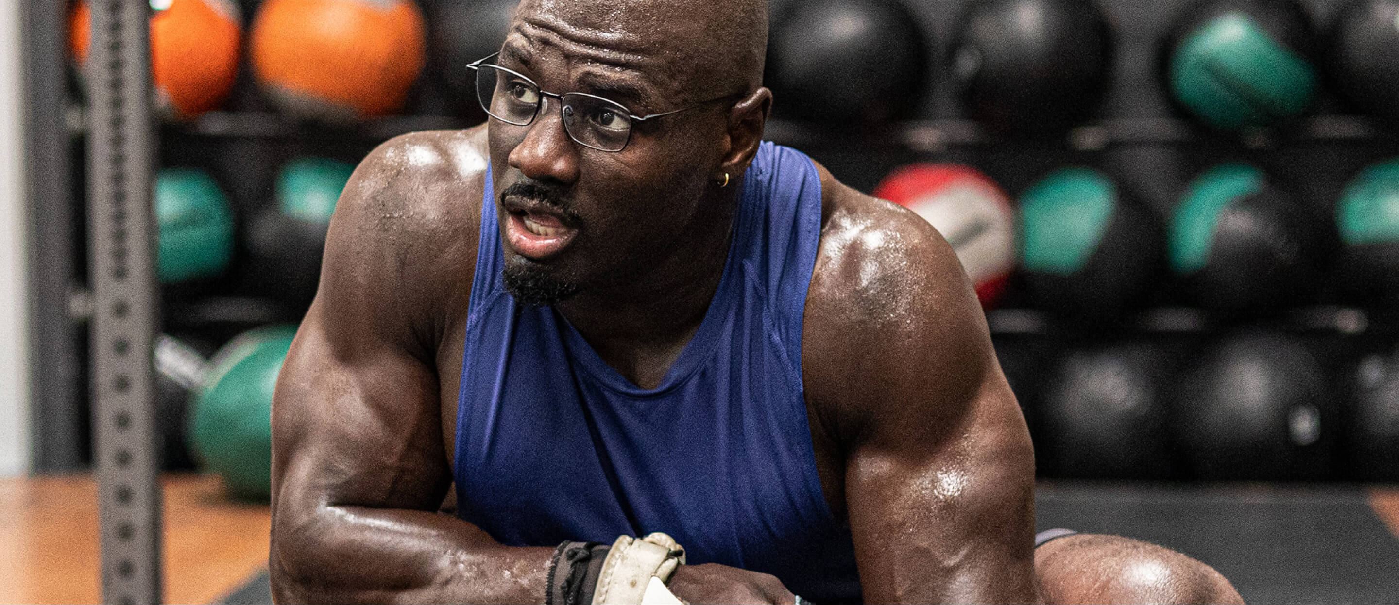 Man in purple tank top and Vapor eyeglasses