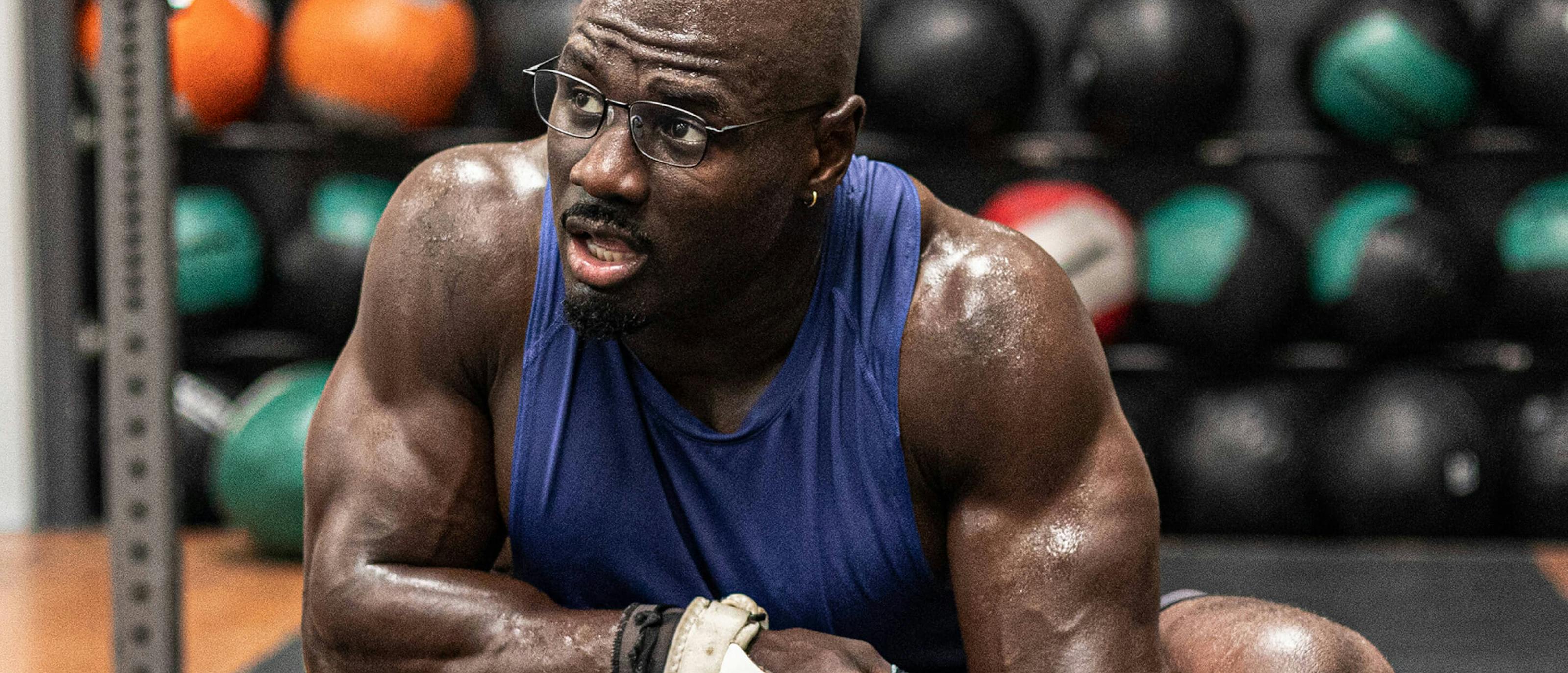 Man in purple tank top and Vapor eyeglasses