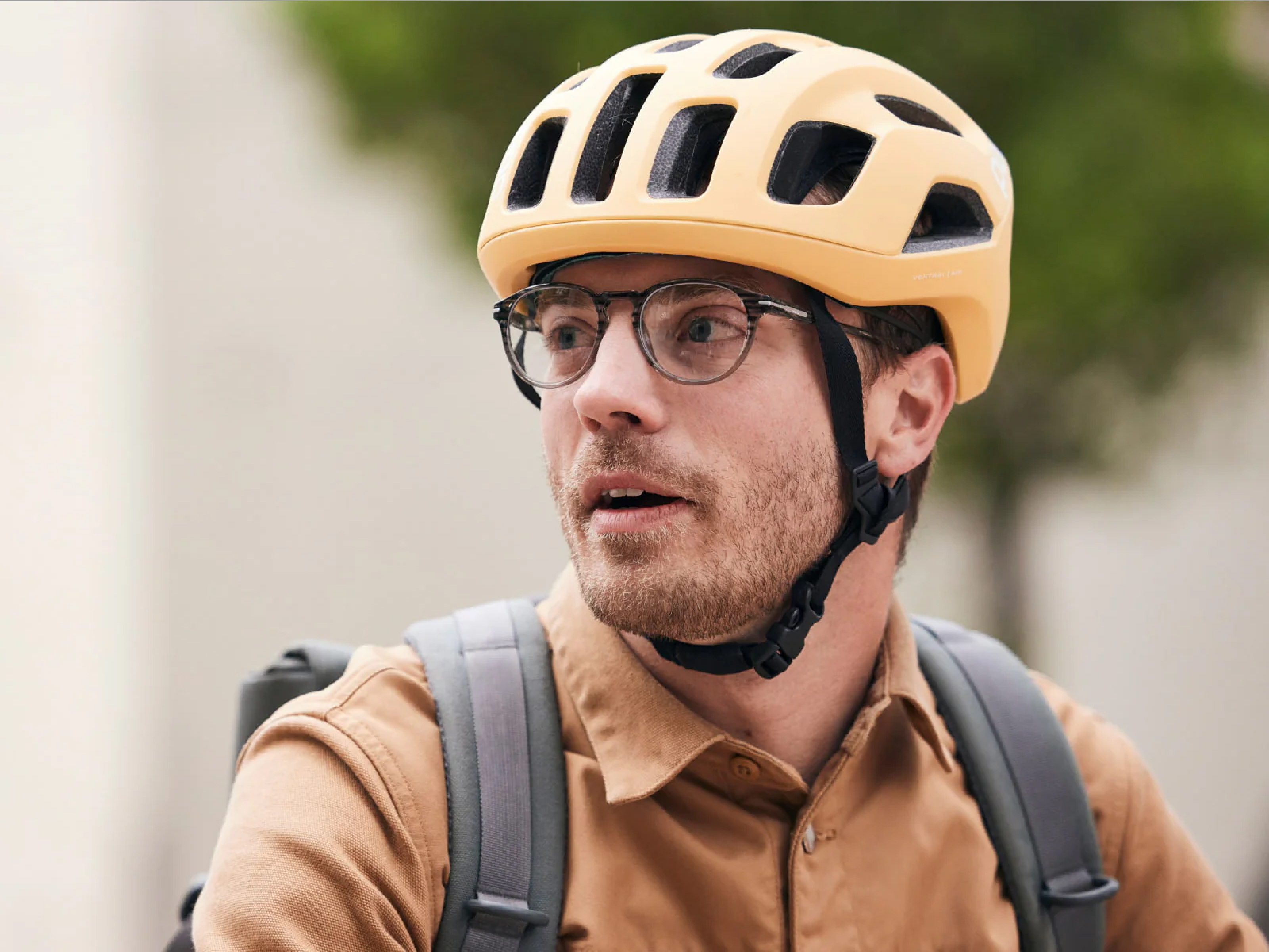 Man wearing bicycle helmet and Oslo Eyeglasses