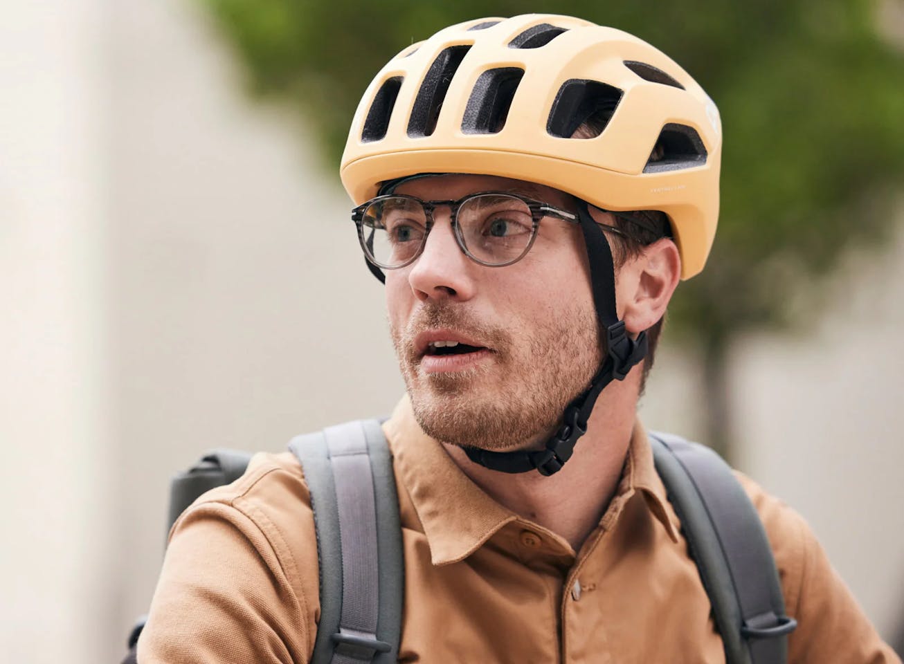 Man wearing bicycle helmet and Oslo Eyeglasses