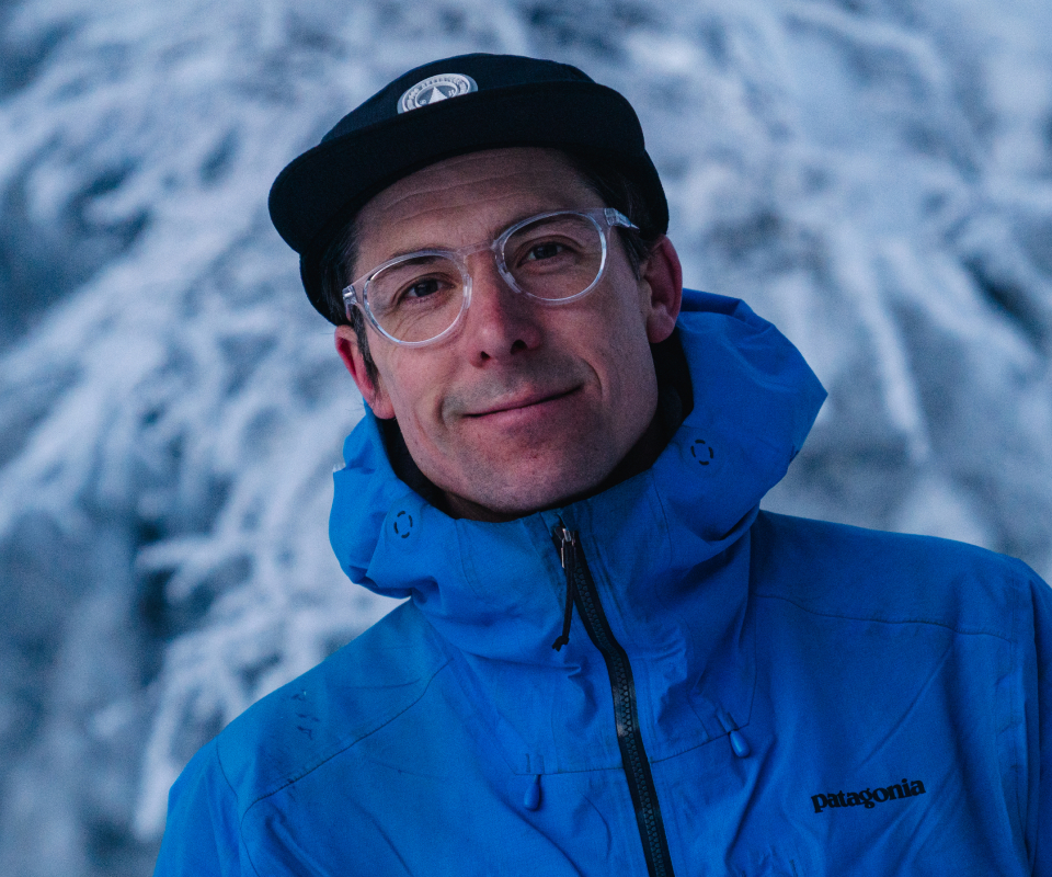 Man in blue snow jacket and Oslo Eyeglasses